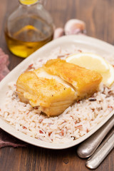 fried cod fish with rice on dish