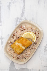 fried cod fish with rice on dish