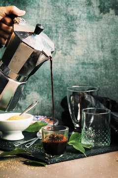 Hand Woman Serving Coffee In Crystal Glass