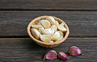Garlic in basket on wooden back..Healthy and benefits of Garlic.