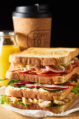 Thick fresh sandwich with ham and vegetables