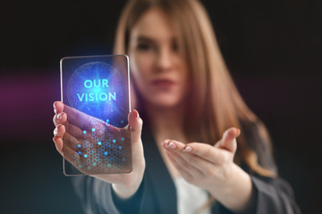 The concept of business, technology, the Internet and the network. A young entrepreneur working on a virtual screen of the future and sees the inscription: Our vision