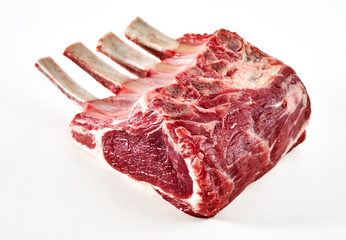 Rack of lamb ready for cooking on white