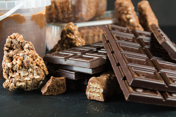 Closeup view of different chocolate which is for sale in container