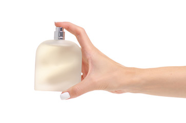 Perfume bottle in hand on white background isolation