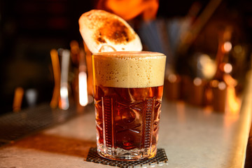 Alcoholic cocktail row on bar table
