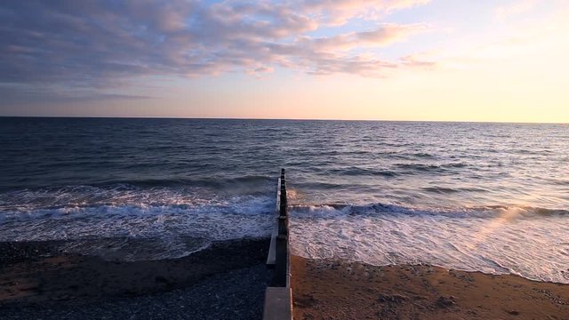 Ocean Waves Crushing Agains Wooden Breakwater