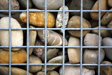 stones pebbles behind lattice detail