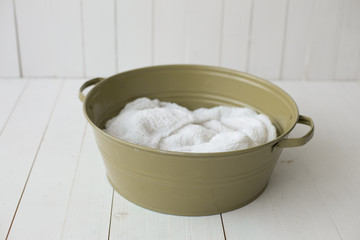 green bowl on a white background. a basin for bathing. pelvis