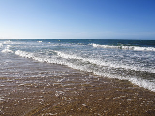 Water surface of sea or ocean with horizon and blue sky or sea with low waves - Aracati, Fortaleza, Ceara, Brazil