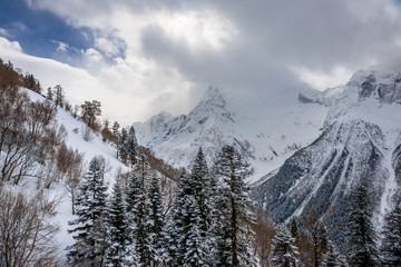 Peak Ine and snow covered Mt. Mussa-Achitara slope in winter. View from Dombay ski lift.