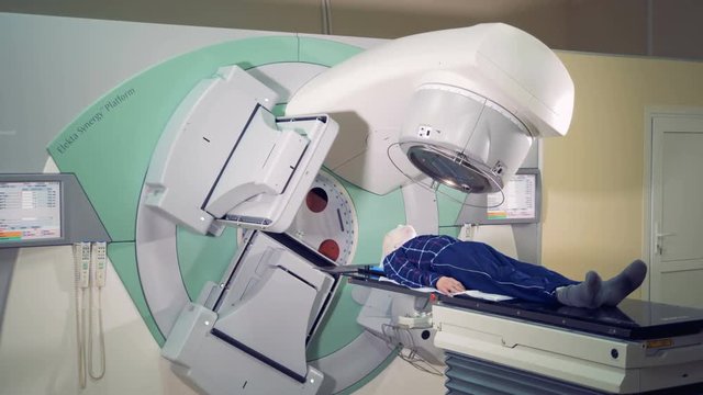 Radiological session is being carried out on a male patient
