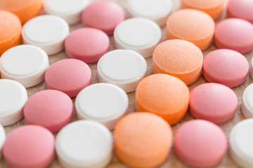 White, pink and orange tablets stripes background. Different Antacids medications help neutralize stomach acid. Antacid Oral : Uses, Side Effects, Interactions, Risks, Warnings