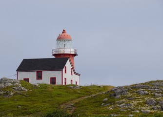 Fototapeta na wymiar red and white lighthouse at Ferryland, Newfoundland Canada