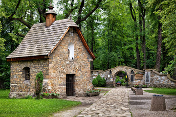 Old Town of Zakopane, Poland. Historic Gasienica Chapel - first sacred building in Zakopane. It was built around 1800 - obrazy, fototapety, plakaty