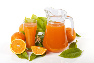 Obraz na płótnie Canvas A glass jug and glass filled with orange juice isolated