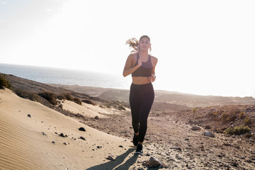 Close up of a woman running in the desert - Powered by Adobe
