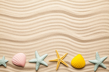 Fototapeta na wymiar Beach background - seashells on yellow sand