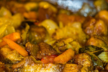 Roast meat, onions, carrots and spices, boiling in oil