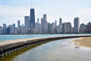 big city skyline and skyscrapers along lakefront shore