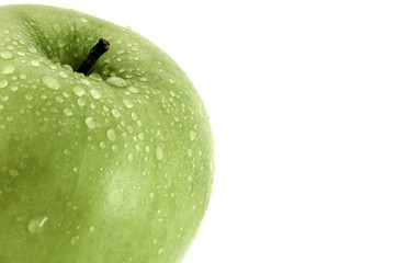 Green apple closeup with white copy space