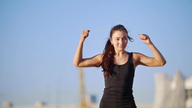 Young Athletic Woman Trains Hands