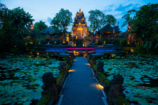 Evening atmosfere iof the Pura Saraswati Temple with beatiful lotus pond, Ubud, Bali in Indonesia