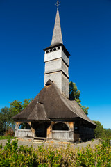 Fototapeta na wymiar The wooden church St. Archangels in Remetea Chioarului