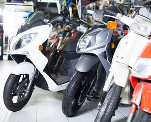 Fototapeta na wymiar modern different colors motorbikes in the shop