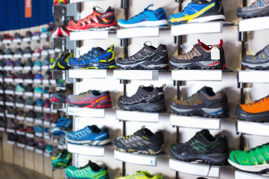 Photo of sport colorful shoes on showcase