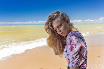 beautiful young girl on the sea background