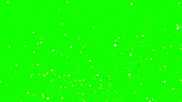 Golden explosion of confetti party on a green background