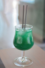 alcoholic cocktail with ice pieces in the sweating glass