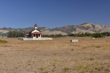 wooden countryside chapel surrounded by farms and hills San Simeon, San Luis Obispo county,...