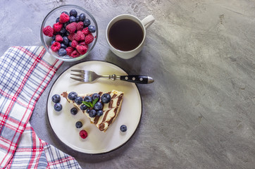 Homemade cheesecake with fresh berries and mint