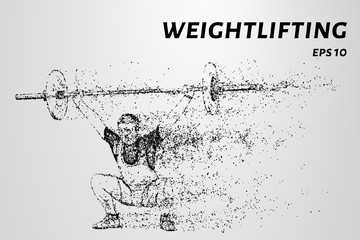 Fototapeta na wymiar The weightlifter raised the bar above his head. Weightlifter of particles.