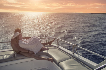 Fototapeta premium Couple in love on a yacht, romantic atmosphere