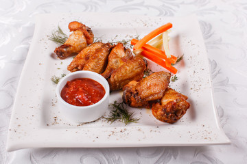 Hot and spicy hot meat dishes. Buffalo Grilled chicken wings with red spicy sauce