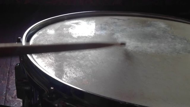 Playing on the snare drum. Time lapse
