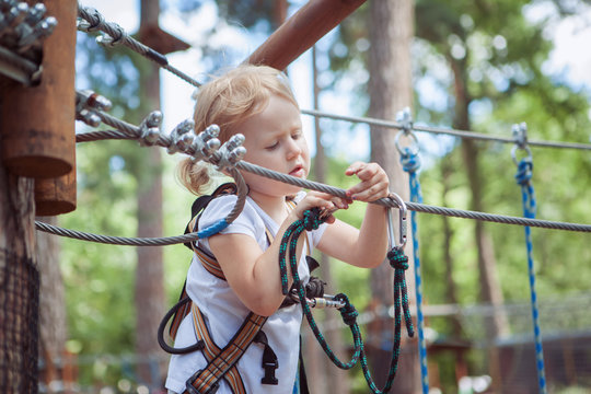 Baby girl runs an obstacle course.