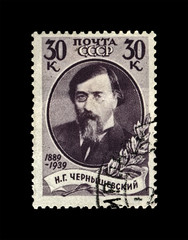 Nikolai Chernyshevsky (1828-1889), famous russian writer, scientist, revolutionary, 50th anniversary of the death, circa 1939. vintage postal stamp isolated on black background. 