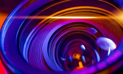 Camera lens with lens reflections on background