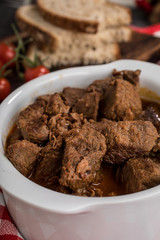 Beef meat stew in ceramic pot.