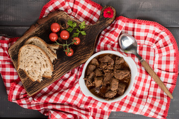 Beef meat stew in ceramic pot.