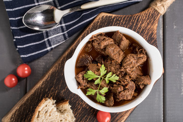 Beef meat stew in ceramic pot.