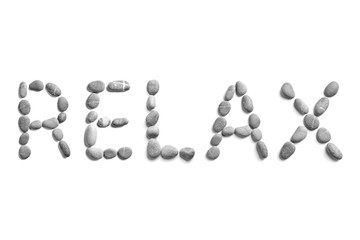 Pebbles on white background, sea pebble. Inscription, text, word: RELAX