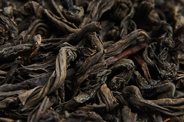 Black tea loose dried leaves. Background