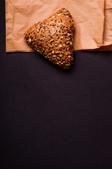 Triangle bun with seed on paper. Copy space