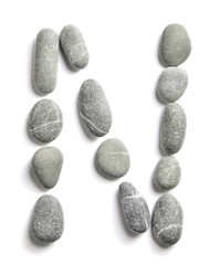 Pebbles on white background, sea pebble. inscription, text, letter; N