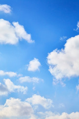 The blue sky with clouds. Spring, winter or summer heaven. Vivid background